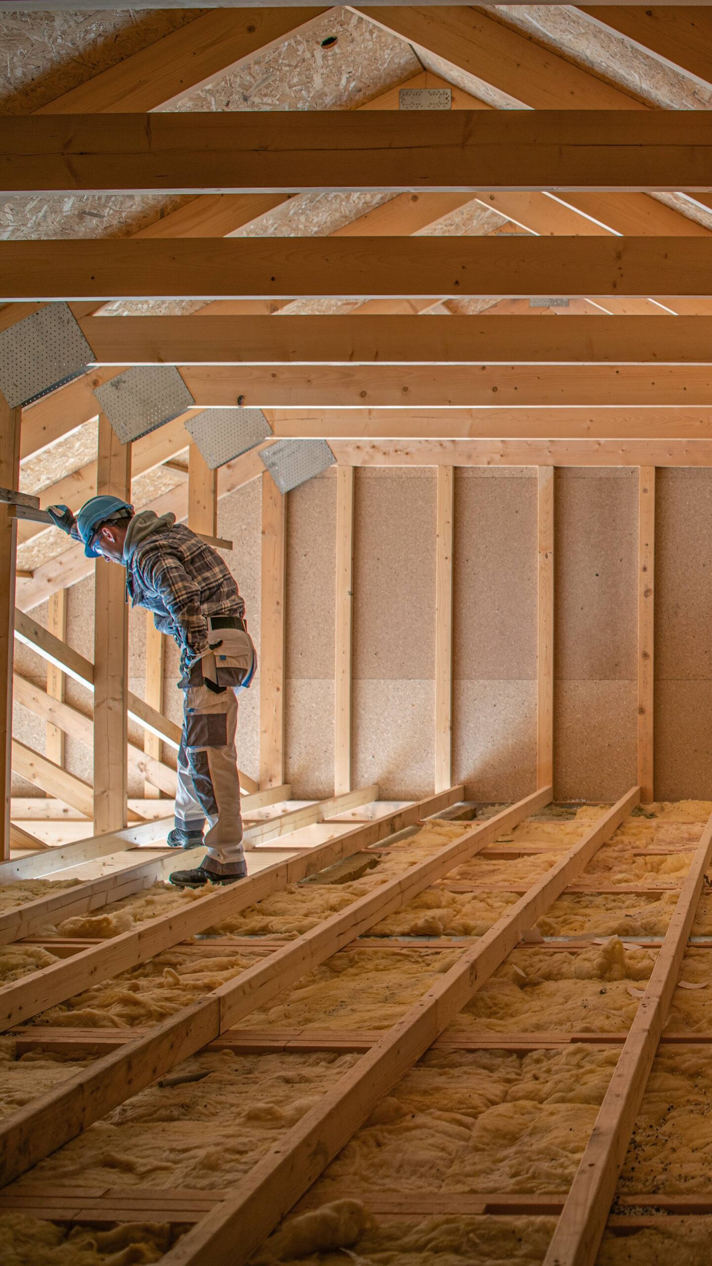 worker inspecting attic
